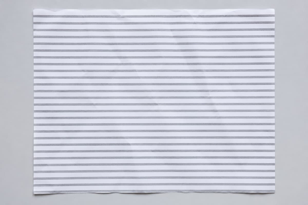 A flat sheet of even grey lines with no margins and no hierarchy